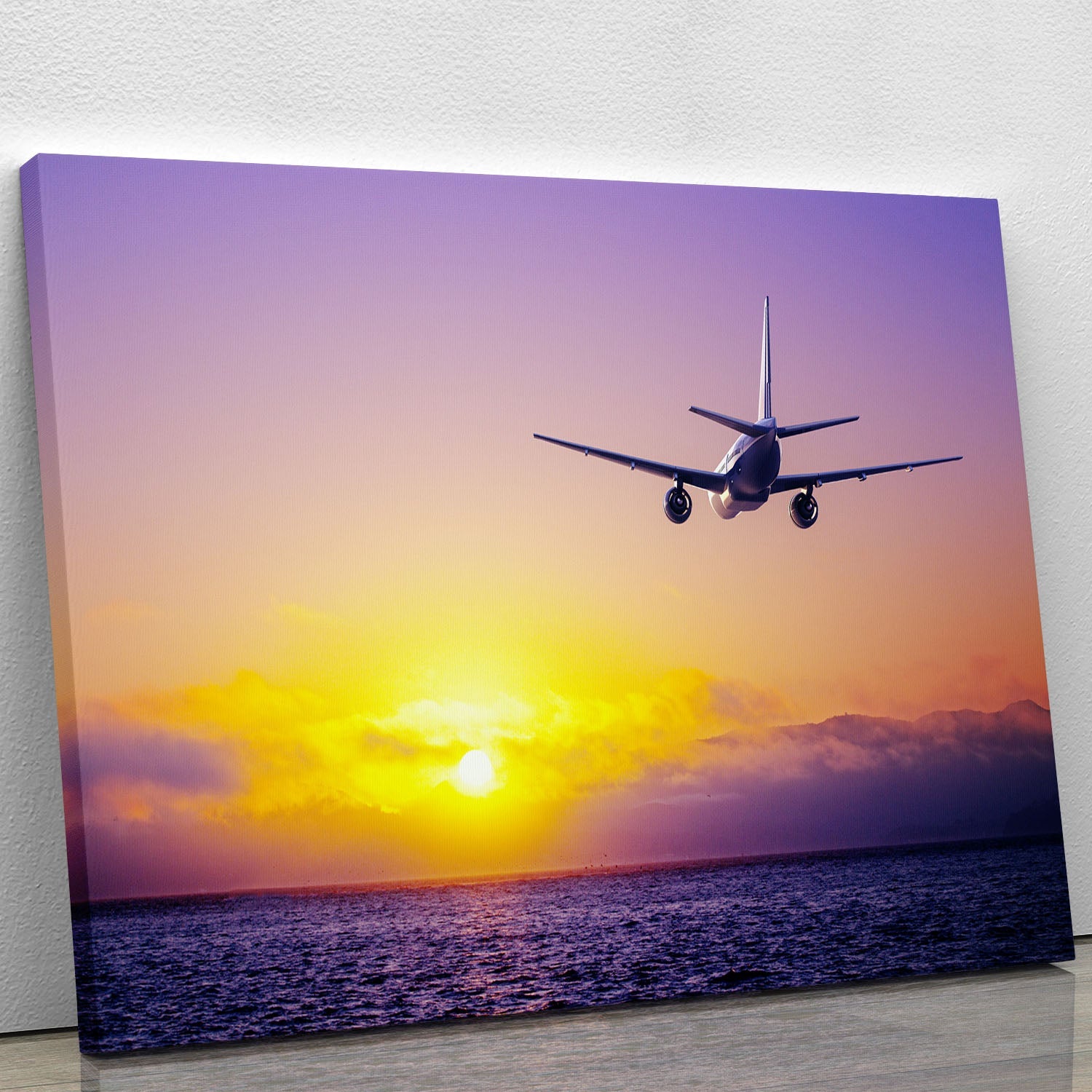 A beautiful canvas print featuring an airplane flying over a serene ocean, capturing the essence of adventure and freedom.