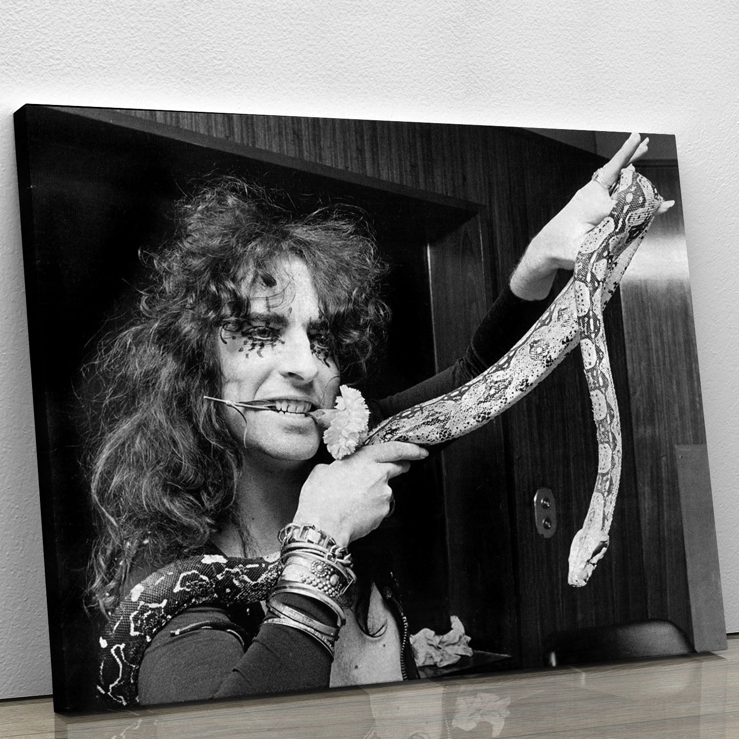 Canvas print of Alice Cooper holding a snake, showcasing vibrant colors and detailed artwork.