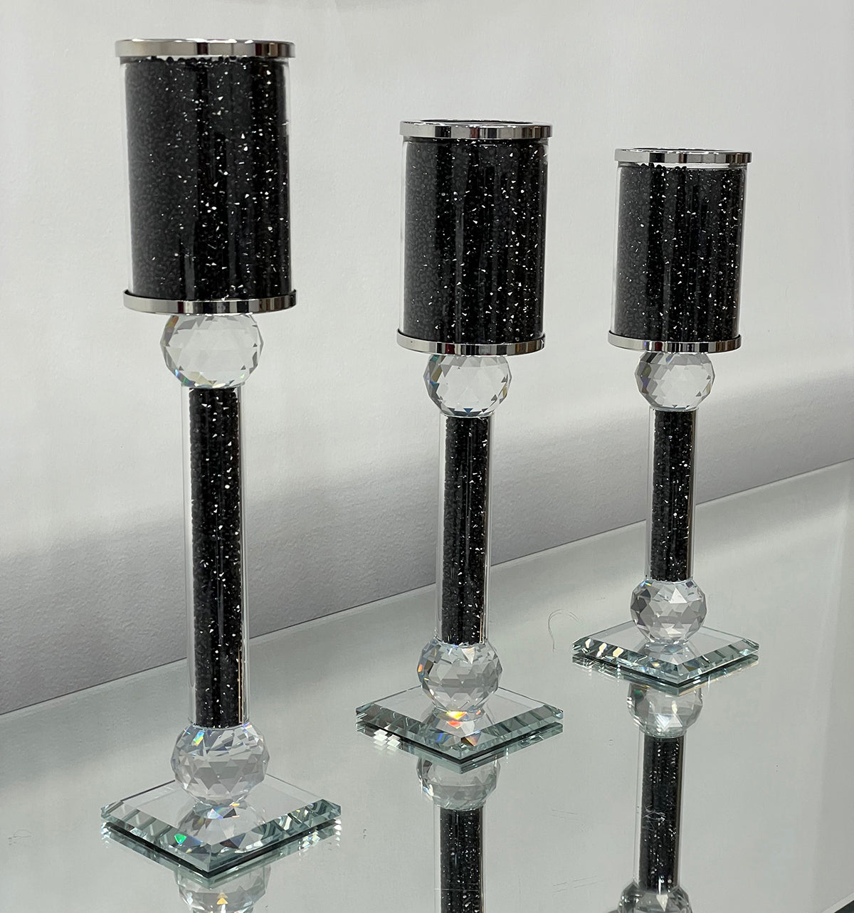 Ambrose 3 Candles Holder Set featuring black crushed diamonds glass, showcasing three elegant candlestick holders in varying heights.