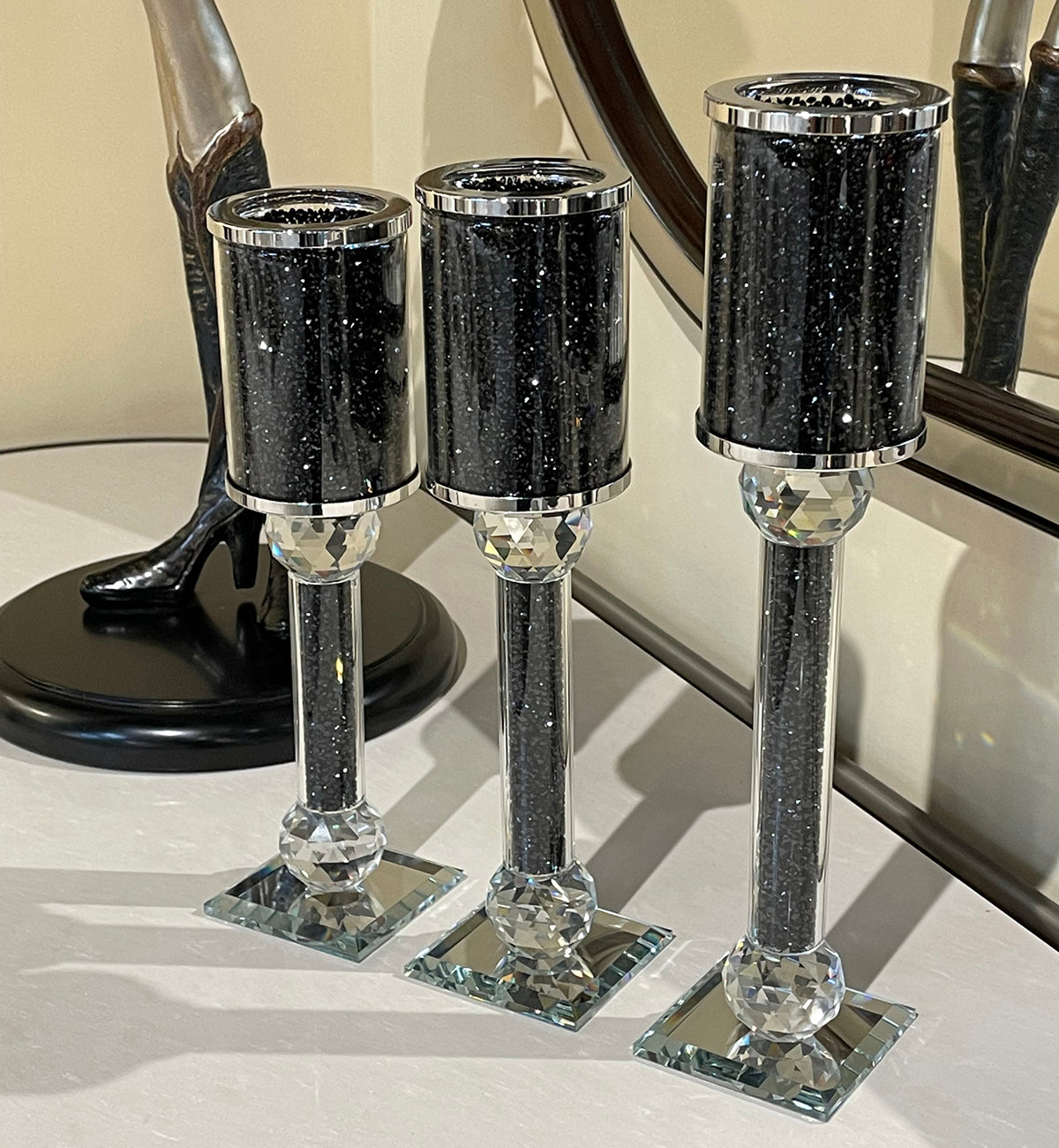 Ambrose 3 Candles Holder Set featuring black crushed diamonds glass, showcasing three elegant candlestick holders in varying heights.