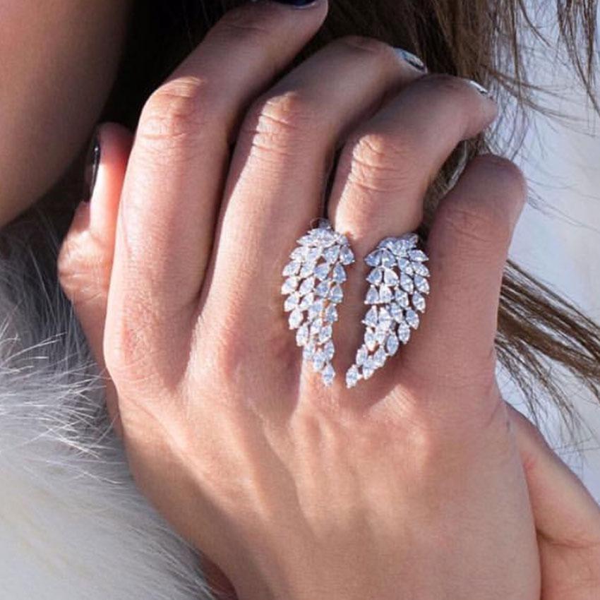 Elegant Angel Wings Ring made of 925 Sterling Silver with a Marquise cut 5A Cz Stone, showcasing intricate wing design.