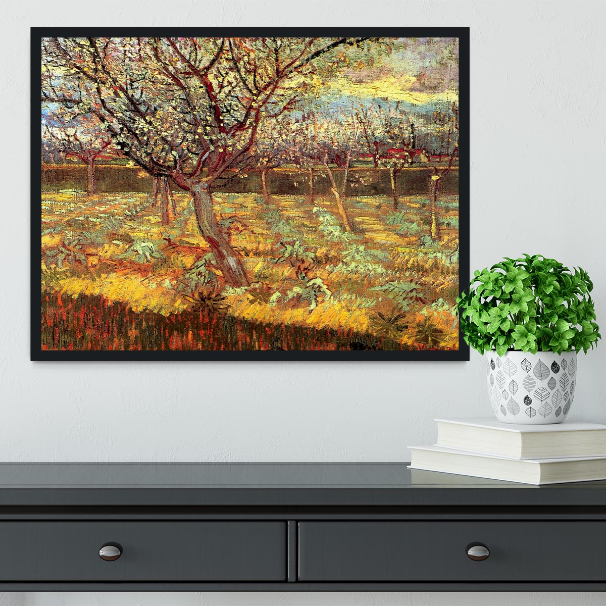 Framed print of Van Gogh's Apricot Trees in Blossom, showcasing vibrant colors and intricate details in a stylish frame.