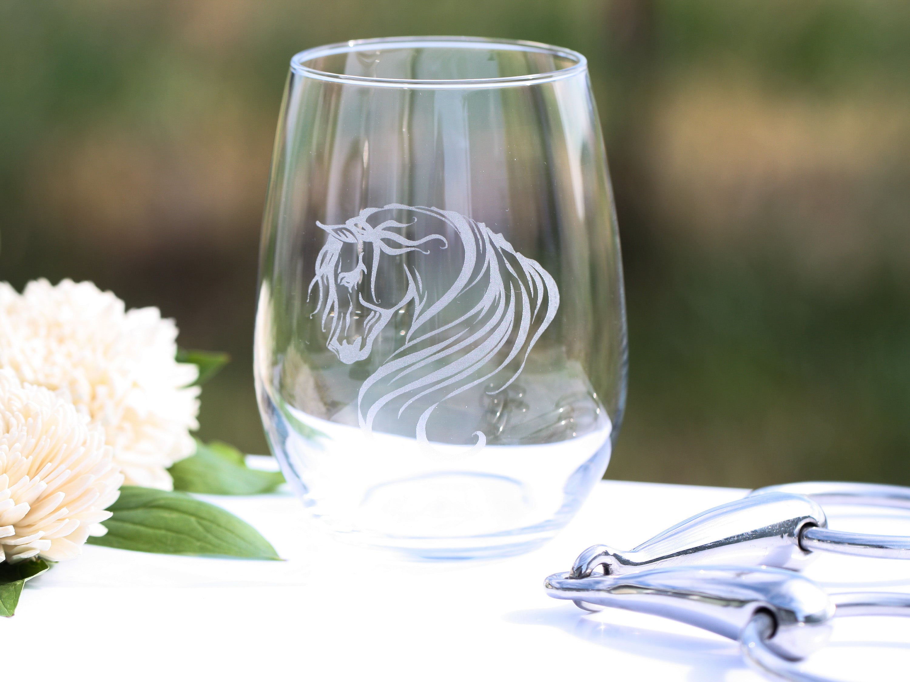 Set of elegant Arabian horse stemless wine glasses with intricate designs, perfect for wine lovers.