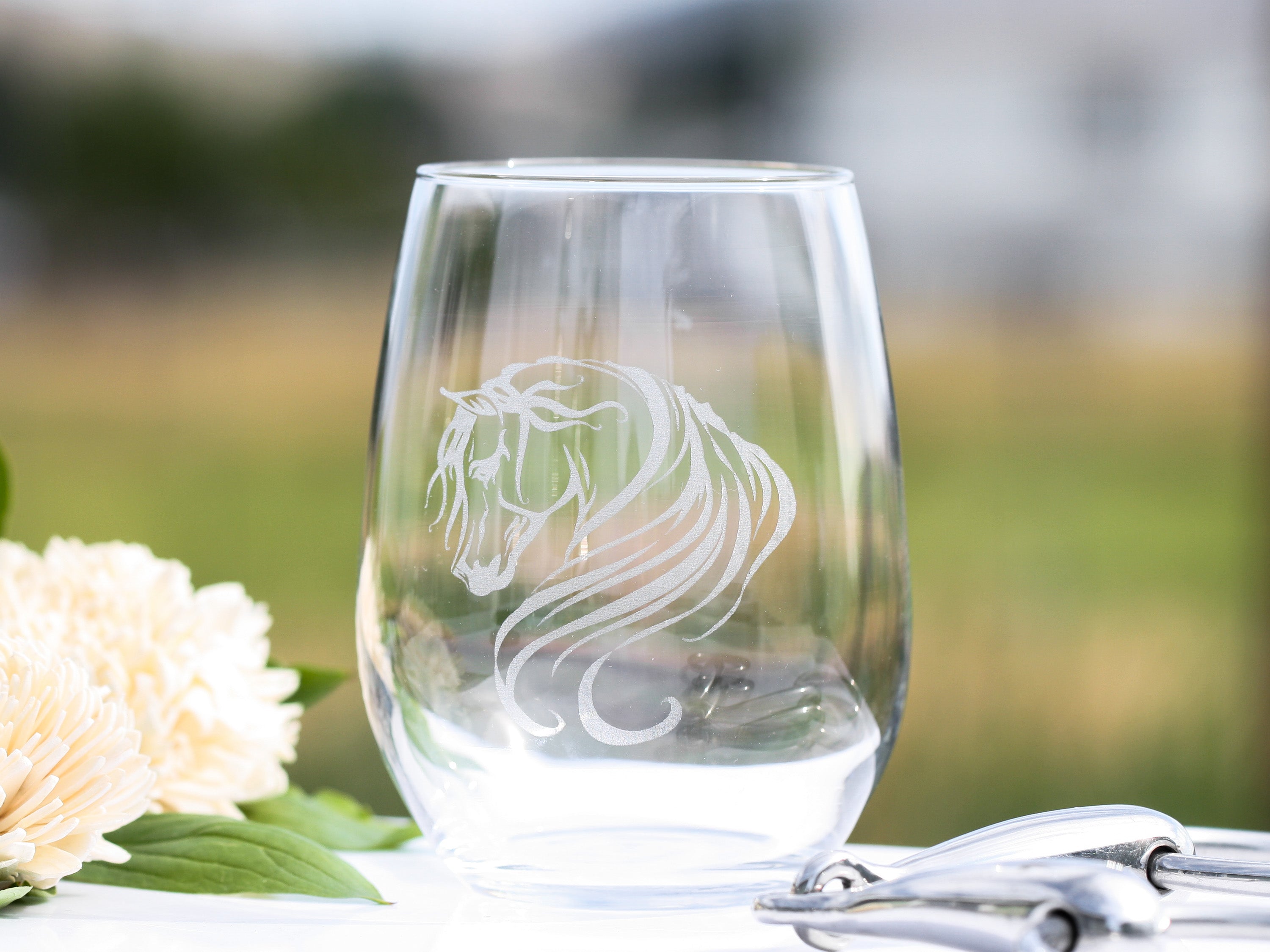 Set of elegant Arabian horse stemless wine glasses with intricate designs, perfect for wine lovers.