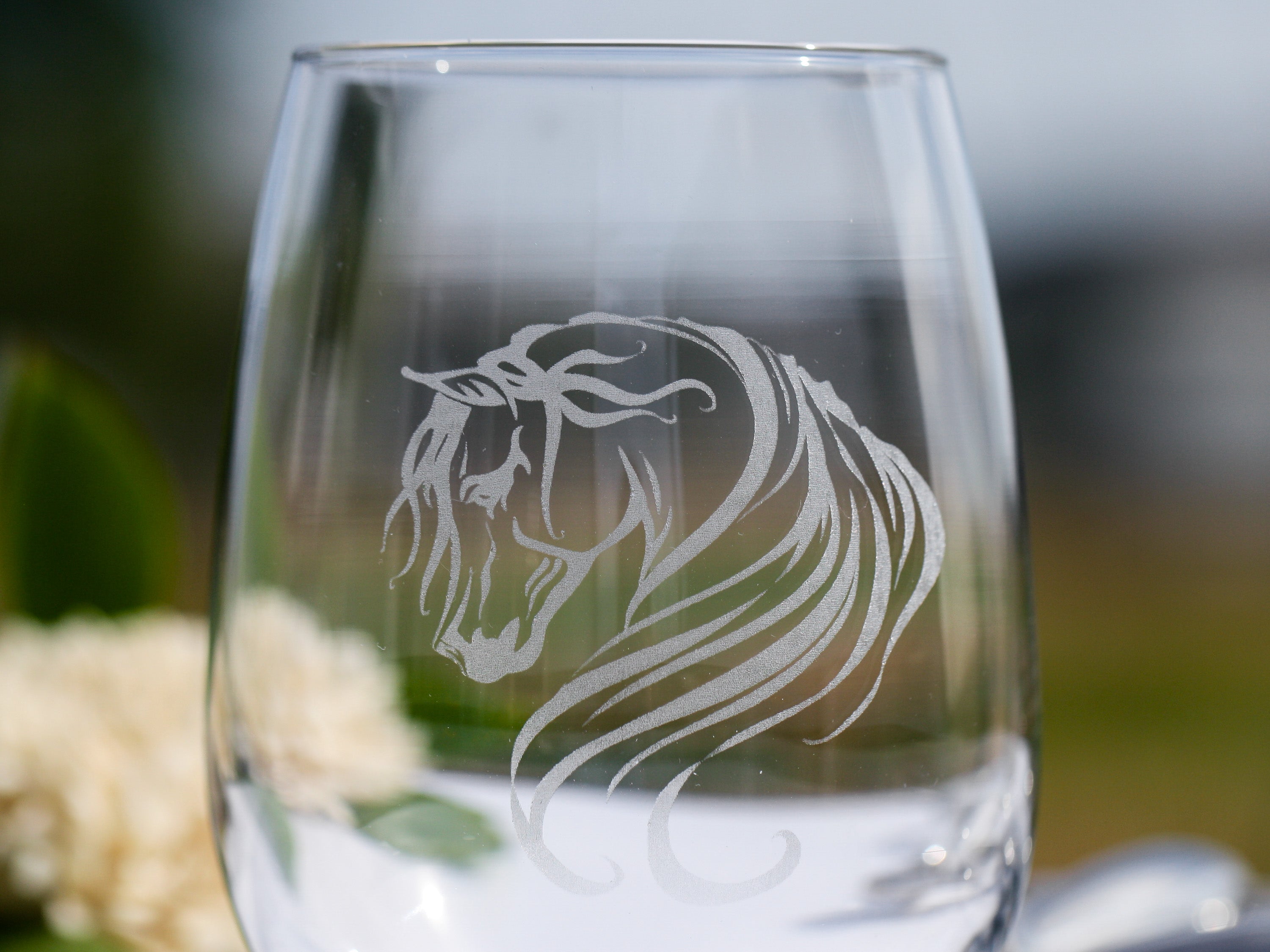 Set of elegant Arabian horse stemless wine glasses with intricate designs, perfect for wine lovers.
