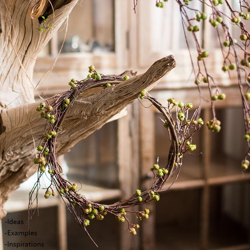 35-inch tall artificial berry vines featuring vibrant green and red colors, perfect for home or office decor.