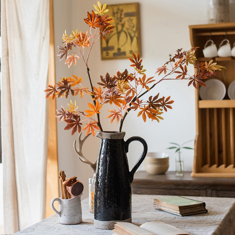 Artificial Fall Color Maple Leaf Stem Faux in vibrant red, orange, and brown hues, showcasing realistic leaves on a long stem.