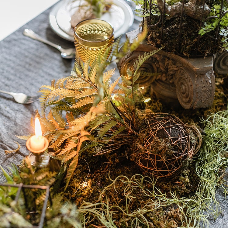 A vibrant artificial fern ball faux plant in fall colors, showcasing green, yellow, and brown hues, perfect for home decor.