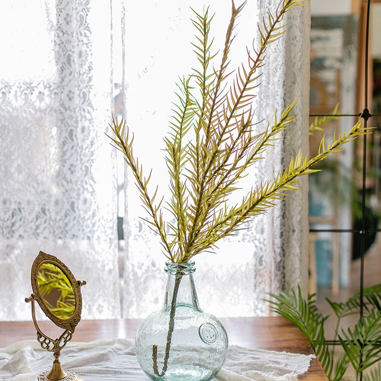 A tall 46-inch yellow artificial flax grass stem, showcasing vibrant color and realistic design, perfect for home decor.