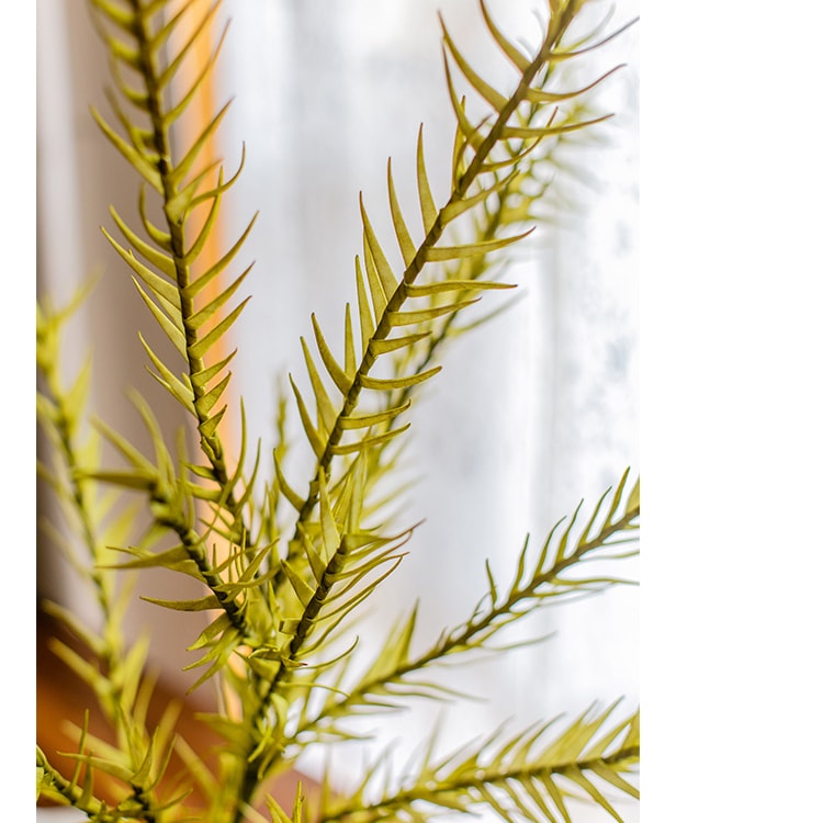 A tall 46-inch yellow artificial flax grass stem, showcasing vibrant color and realistic design, perfect for home decor.