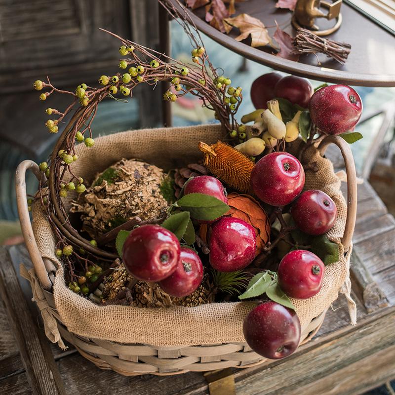 A vibrant artificial red apple stem featuring two lifelike apples and green leaves, standing 15 inches tall.