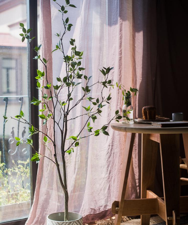 Artificial Green Leaf Faux Tree in a stylish black pot, showcasing realistic green leaves and a lifelike appearance.