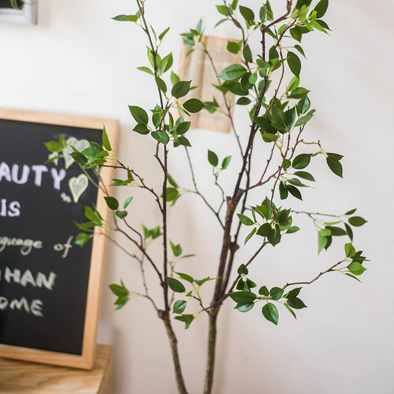 Artificial Green Leaf Faux Tree in a stylish black pot, showcasing realistic green leaves and a lifelike appearance.