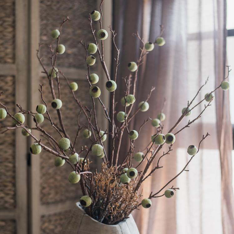 34-inch tall Artificial Kou Li Stem in Green, featuring realistic silk leaves and mixed colors, perfect for home decor.