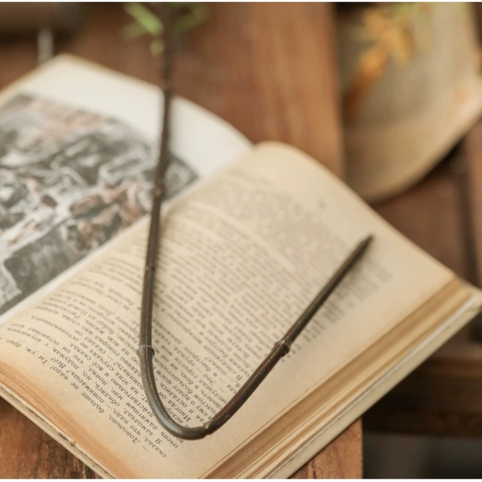 A 49-inch tall artificial rosemary stem with vibrant green leaves, perfect for home decor.