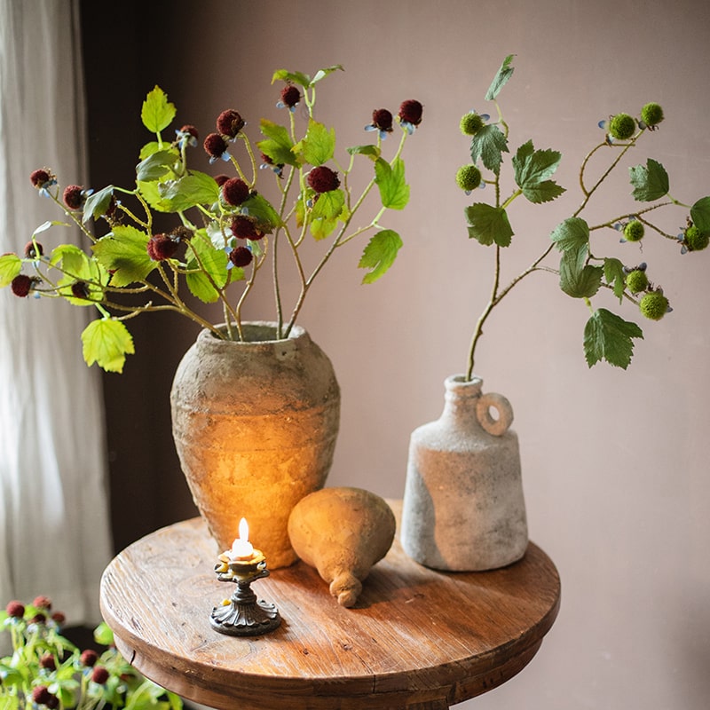 27-inch tall artificial plane plant fruit stem with vibrant green and red colors, designed for home and office decor.