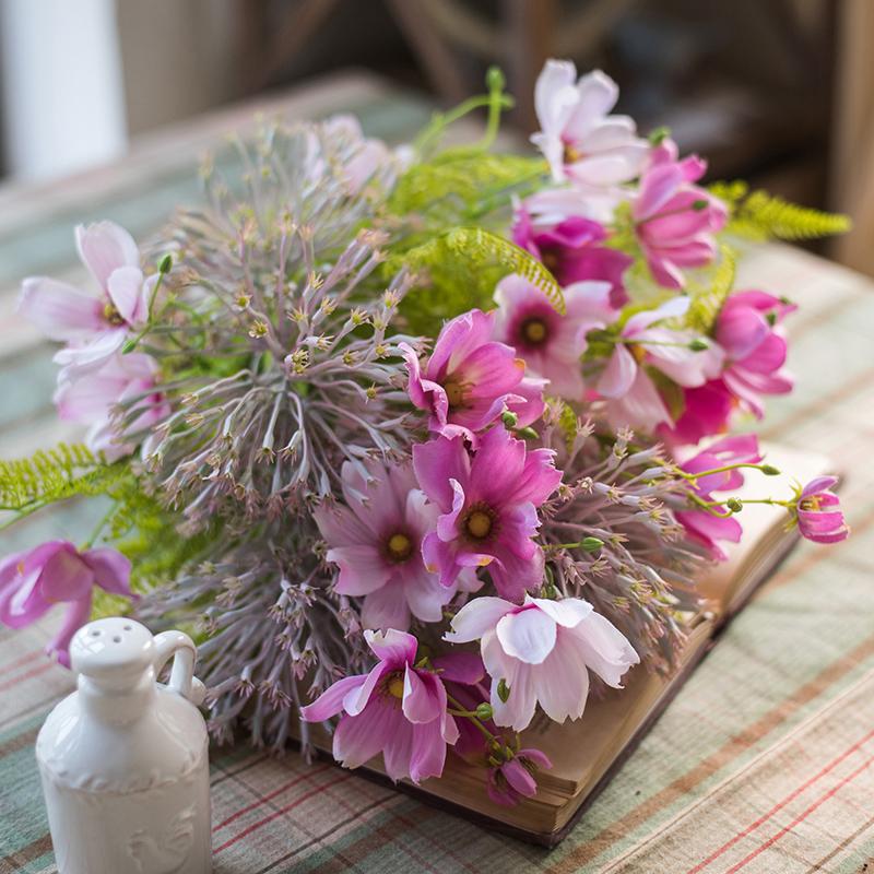 A beautiful 20-inch tall artificial silk flower bouquet featuring vibrant pink daisies and lush greenery, perfect for home decor.