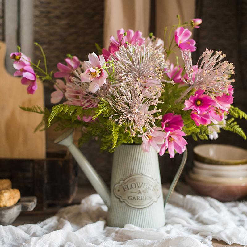 A beautiful 20-inch tall artificial silk flower bouquet featuring vibrant pink daisies and lush greenery, perfect for home decor.