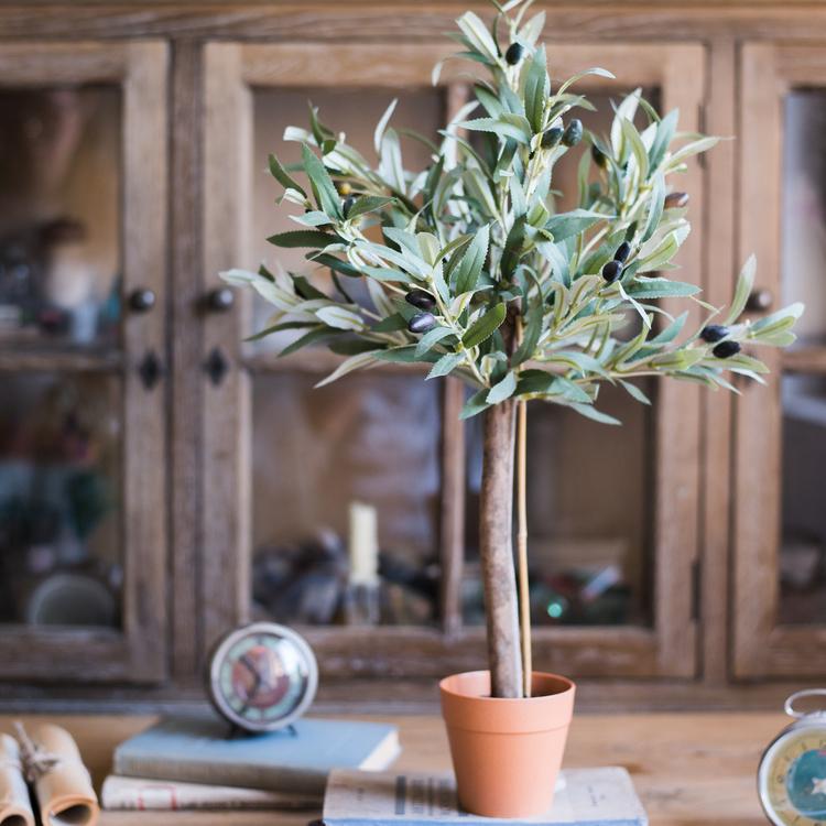 A realistic 24-inch tall artificial small olive tree in a decorative pot, featuring lush green leaves and a natural appearance.