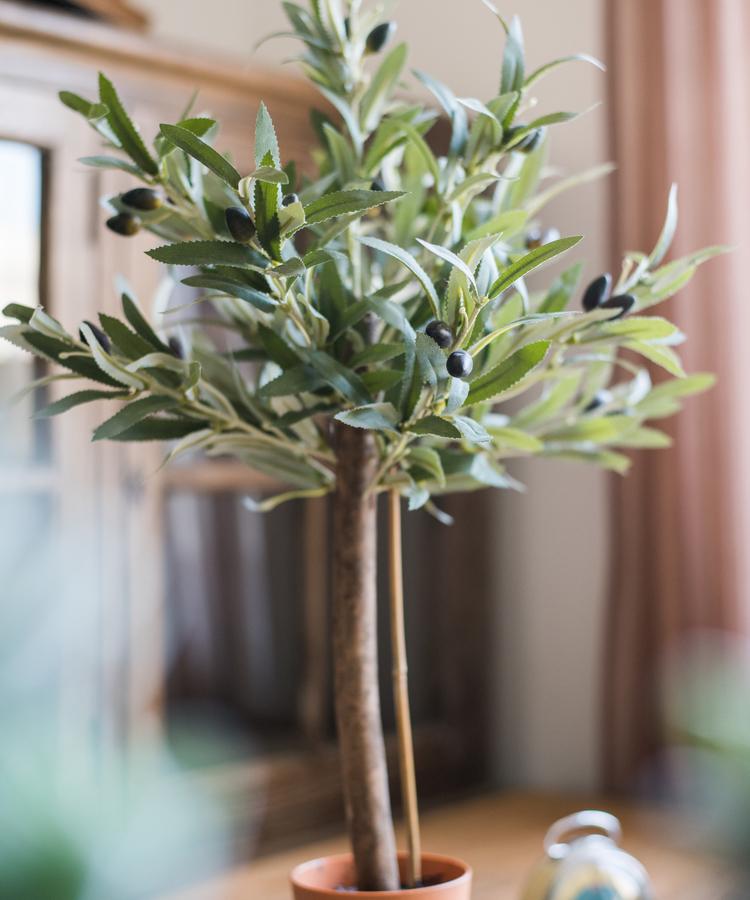 A realistic 24-inch tall artificial small olive tree in a decorative pot, featuring lush green leaves and a natural appearance.