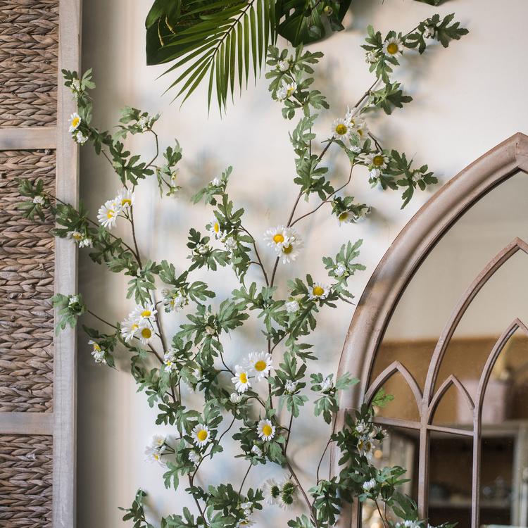 A long 67-inch artificial sunflower vine featuring vibrant yellow sunflowers and lush green leaves, perfect for home decor.