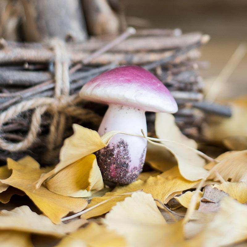 A vibrant artificial veggie mushroom, 4.7 inches tall, featuring a realistic design in mixed colors of yellow and purple.