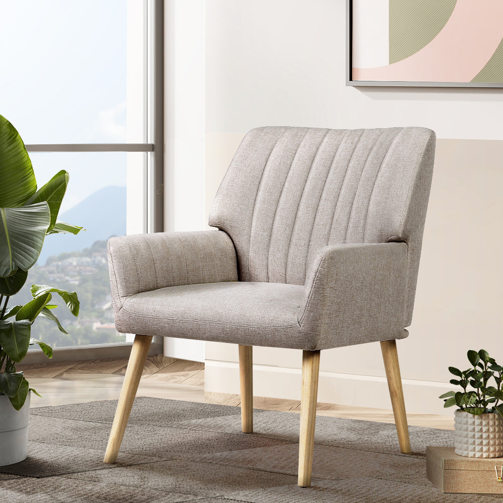 Artiss Sebastini Armchair in beige faux fabric with rubber wood legs, showcasing its elegant design and plush seating.