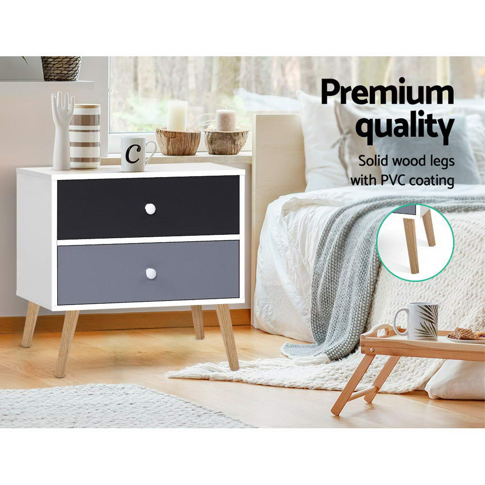 Artiss Bedside Table featuring a Scandinavian-inspired design with two drawers, solid wood legs, and a chic black and white finish.