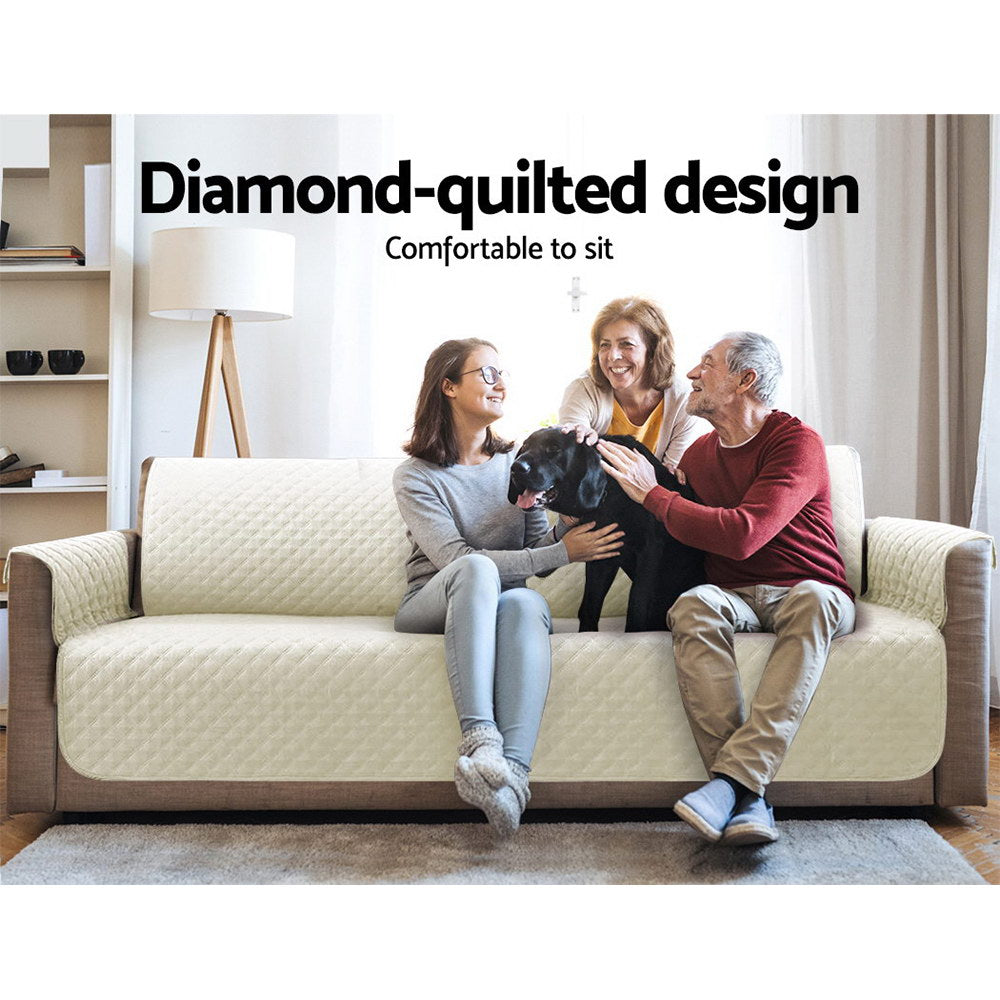 Artiss 3 Seater Sofa Cover in beige, featuring a diamond-quilted design and water-resistant fabric, draped over a stylish couch.