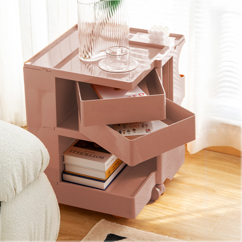ArtissIn Bedside Table in vibrant Pink (Peony) color, showcasing multiple fold-out shelves and smooth wheels for easy mobility.