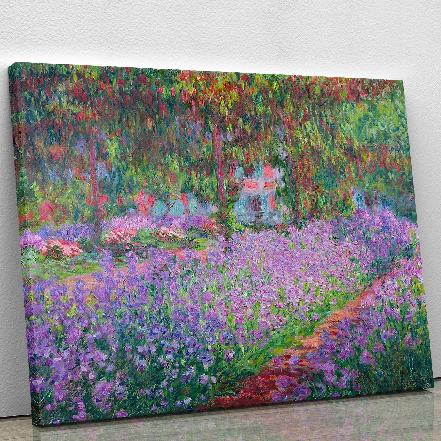 Canvas print of Artists Garden by Monet featuring vibrant flowers and lush greenery, perfect for home decor.