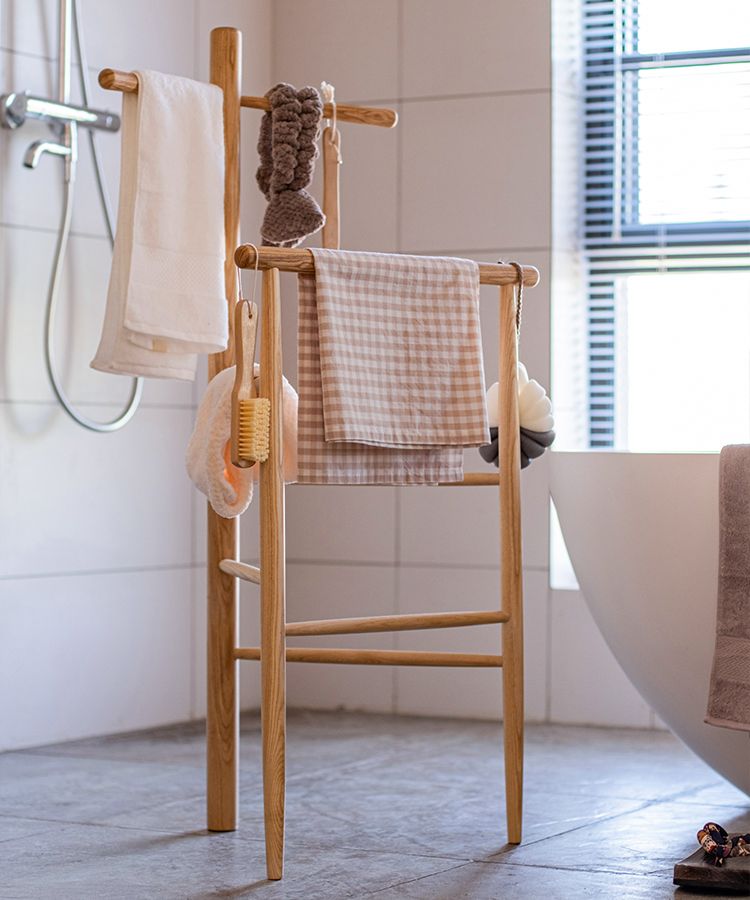 Freestanding Ash Wood Bath Towel Rack in natural color, showcasing unique wood grain and stylish design.