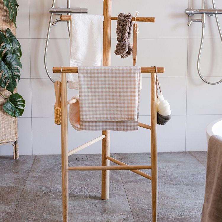 Freestanding Ash Wood Bath Towel Rack in natural color, showcasing unique wood grain and stylish design.