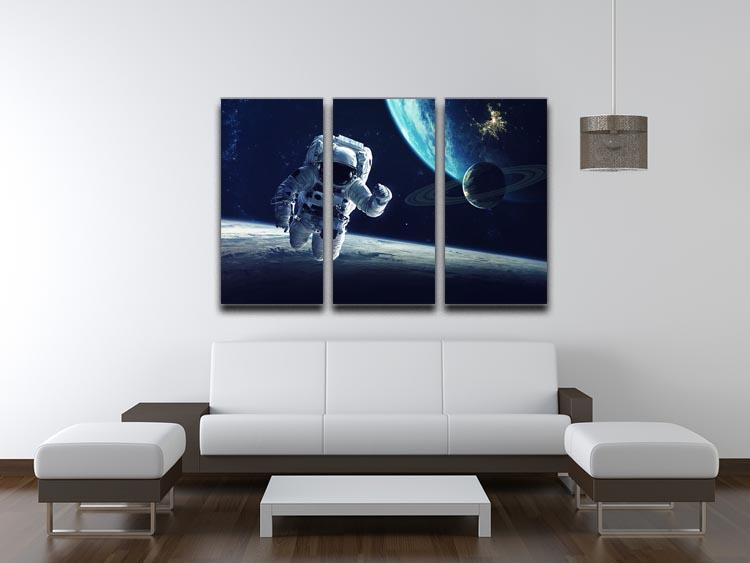Astronaut at spacewalk 3-panel canvas print showcasing a stunning cosmic scene.