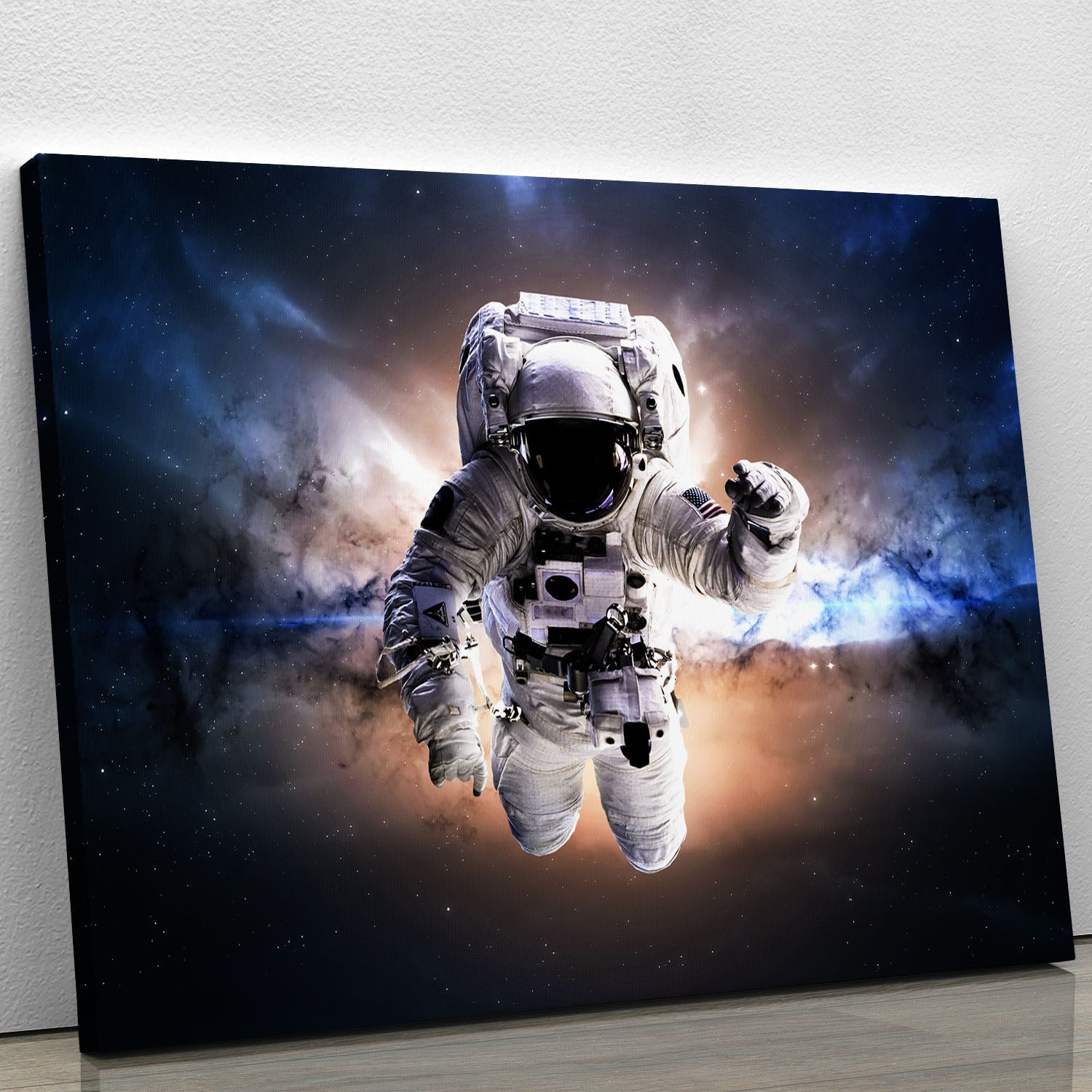 A vibrant canvas print featuring an astronaut floating in a colorful galaxy, showcasing stars and cosmic elements.