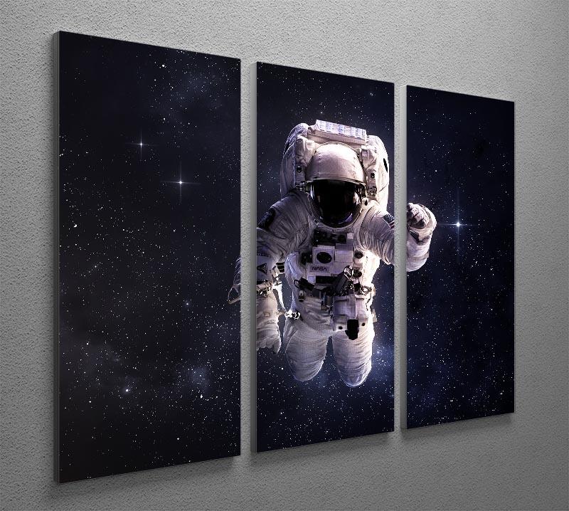 A stunning 3-panel canvas print featuring an astronaut floating in outer space surrounded by stars, perfect for modern decor.