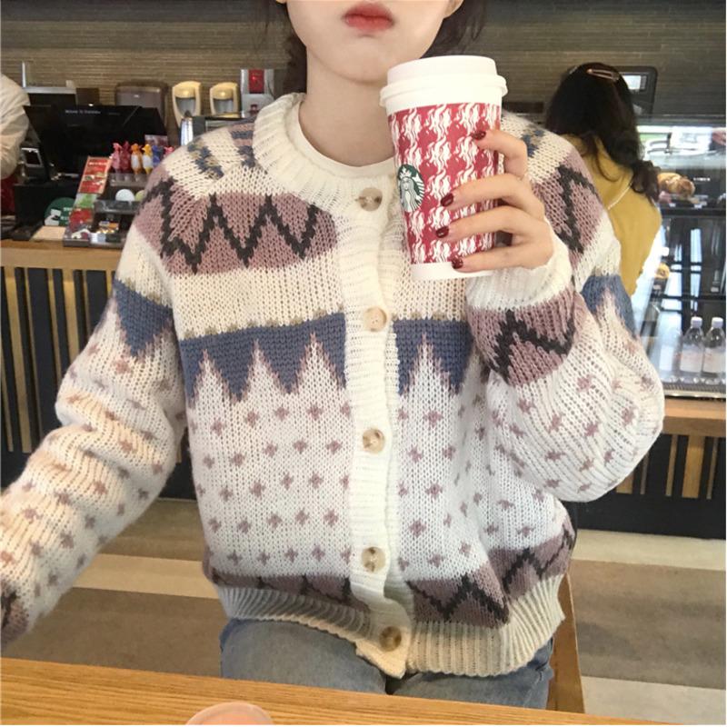 A stylish Autumn Winter Women Christmas Cardigan Sweater featuring a loose fit, geometric pattern, and button decoration, perfect for winter wear.