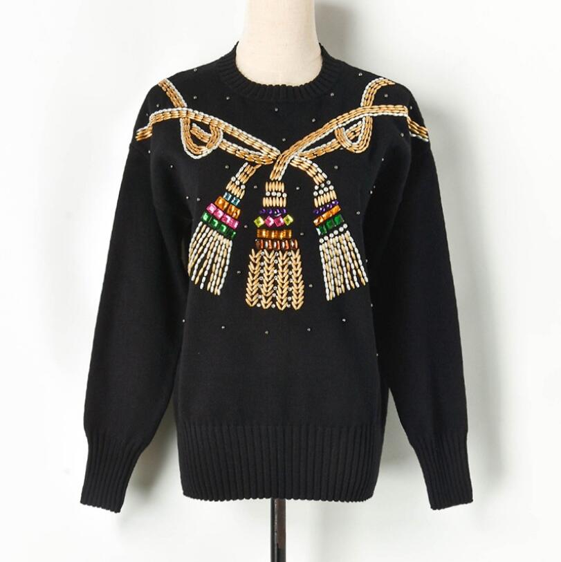Autumn winter women sweater featuring heavy beading and a rope knot design, showcasing its stylish and elegant look.