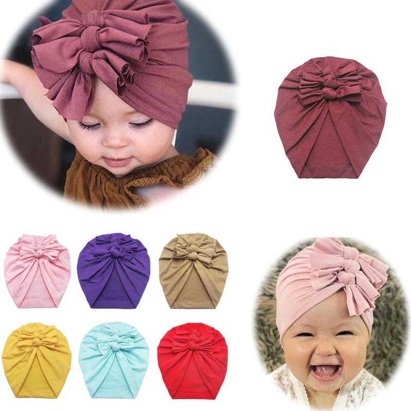 Baby Headband Hat with Bowknot Print, made of soft cotton, designed for infant girls, showcasing a stylish and comfortable fit.