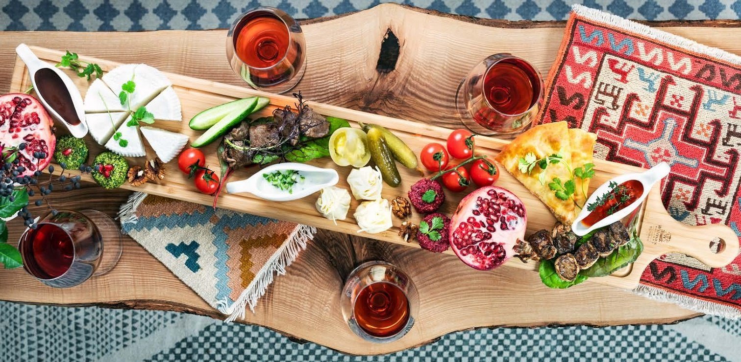 WILMAX Bamboo Charcuterie Board with Handle, 39.4 inches by 7.9 inches, showcasing its elegant design and natural bamboo texture.