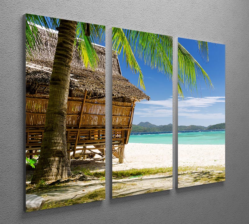 A beautiful 3-panel canvas print featuring a bamboo hut on a tropical beach, showcasing vibrant colors and serene scenery.