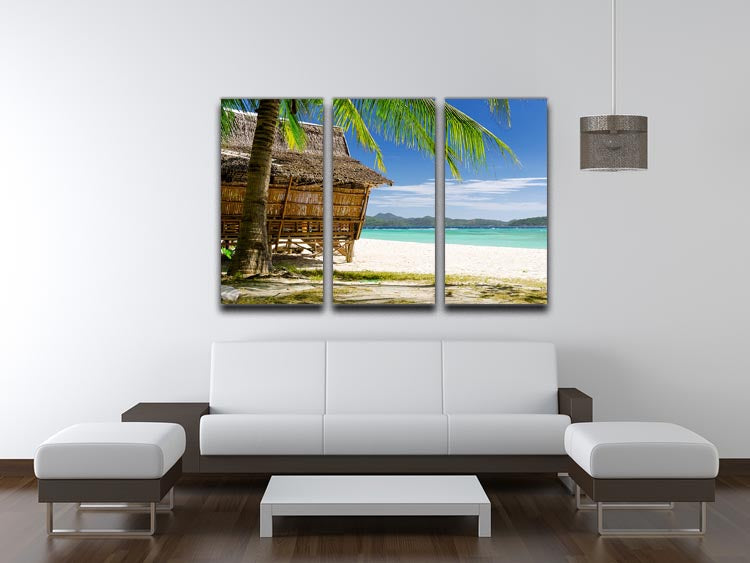 A beautiful 3-panel canvas print featuring a bamboo hut on a tropical beach, showcasing vibrant colors and serene scenery.