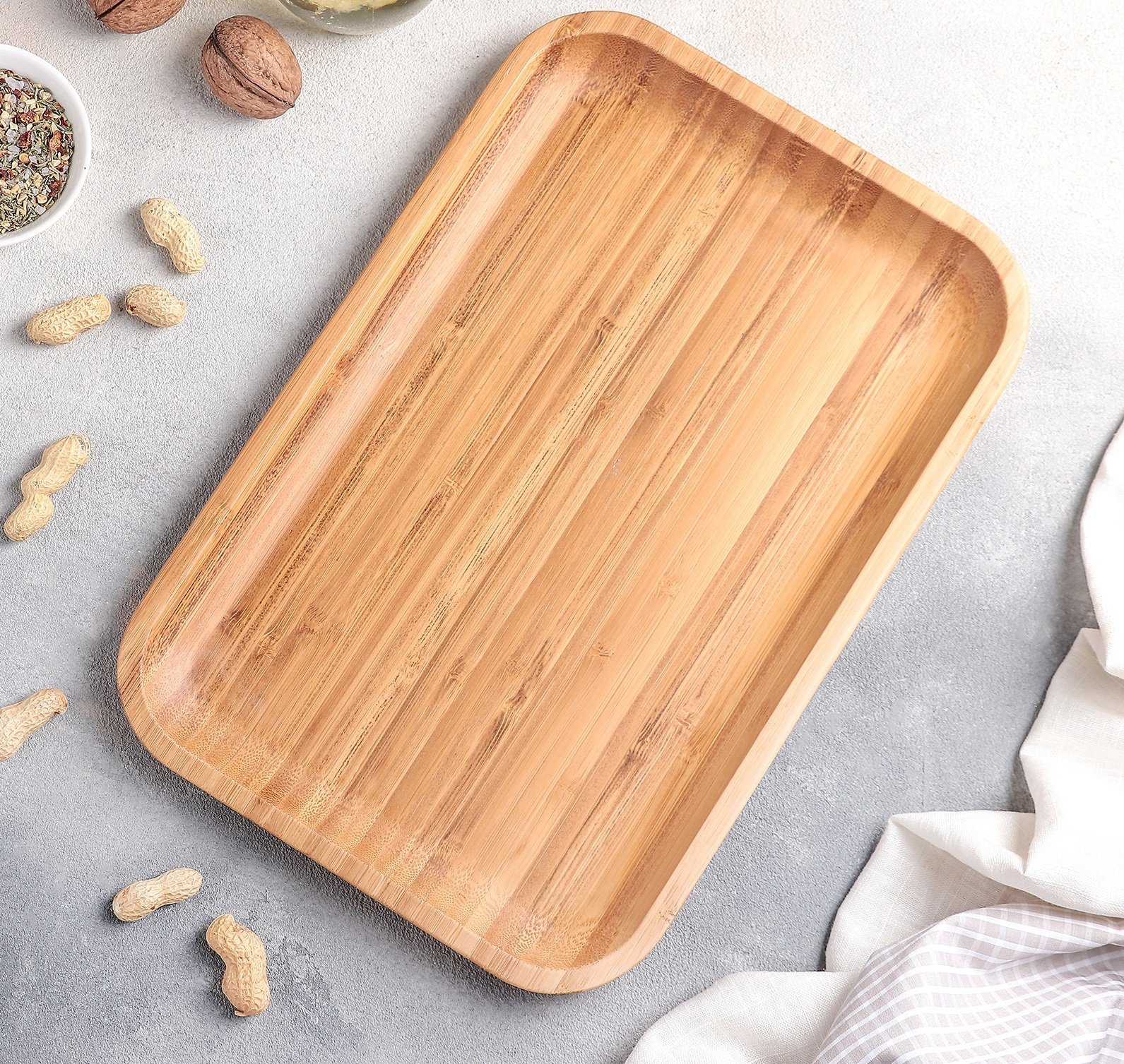 WILMAX bamboo platter measuring 12 inches by 8 inches, showcasing its elegant design and natural texture, ideal for serving appetizers and barbecues.