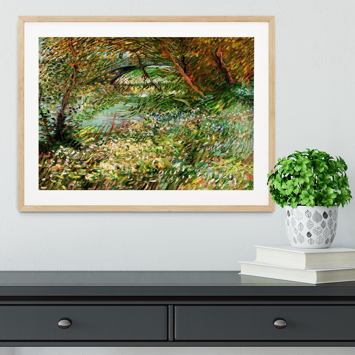 Framed artwork of Van Gogh's Banks of the Seine with Pont de Clichy in the Spring, showcasing vibrant colors and intricate details.