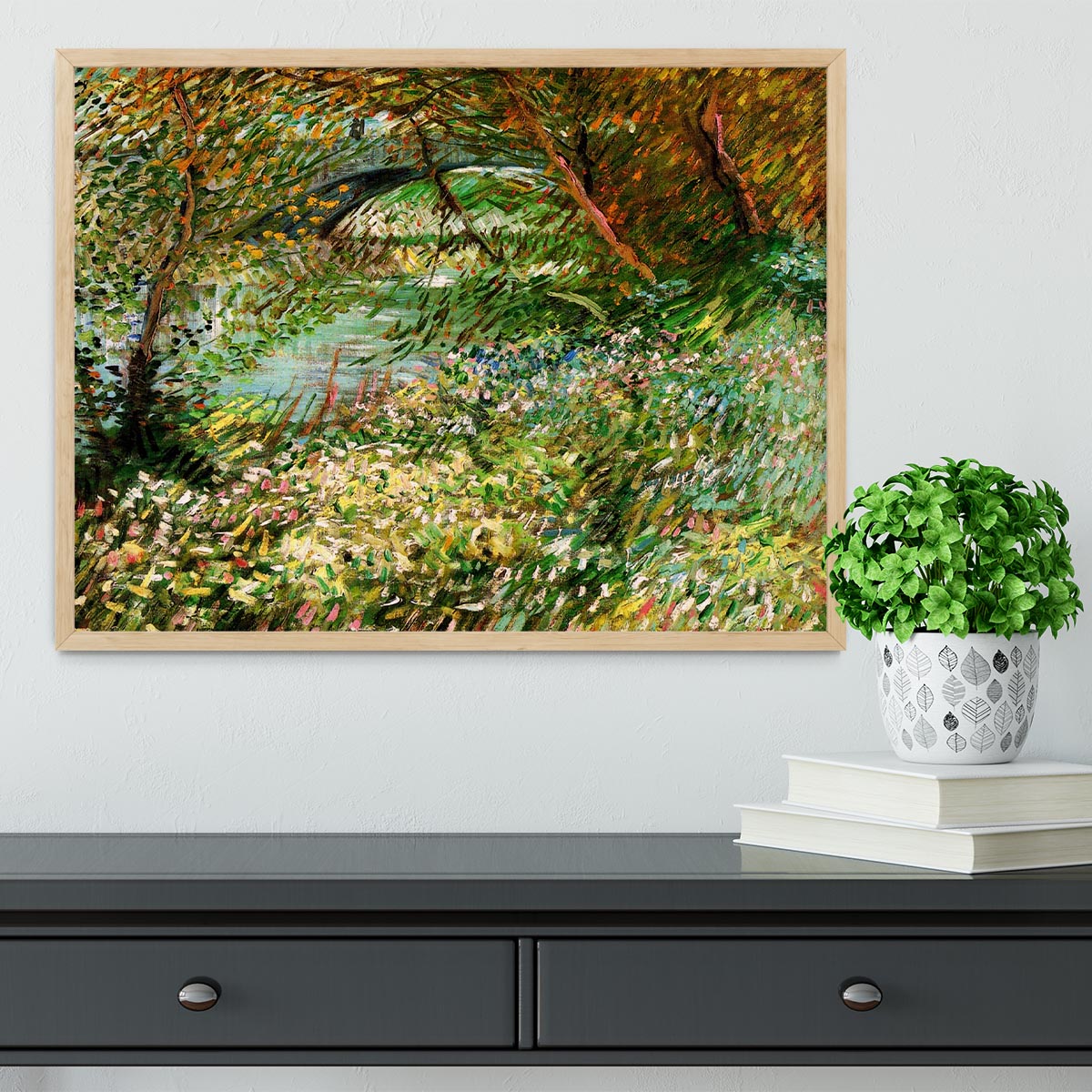 Framed artwork of Van Gogh's Banks of the Seine with Pont de Clichy in the Spring, showcasing vibrant colors and intricate details.
