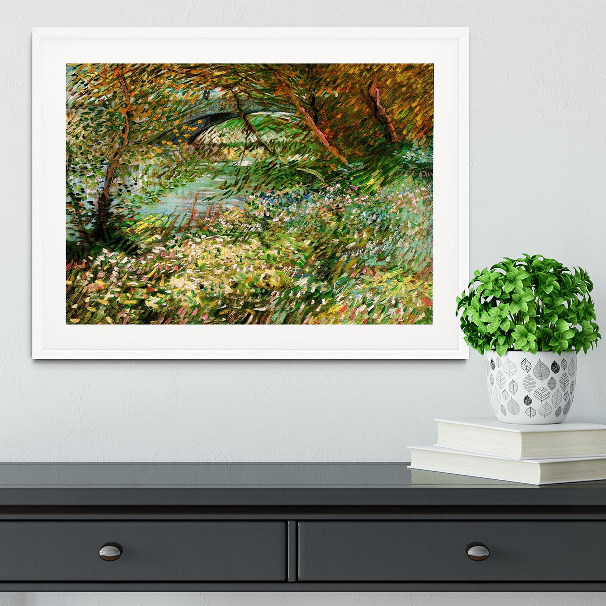 Framed artwork of Van Gogh's Banks of the Seine with Pont de Clichy in the Spring, showcasing vibrant colors and intricate details.