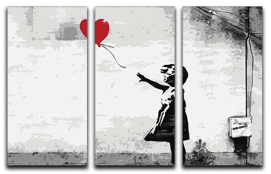 Banksy Balloon Girl Love Heart 3 Split Panel Canvas Print featuring a girl reaching for a heart-shaped balloon across three panels.
