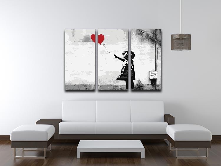 Banksy Balloon Girl Love Heart 3 Split Panel Canvas Print featuring a girl reaching for a heart-shaped balloon across three panels.