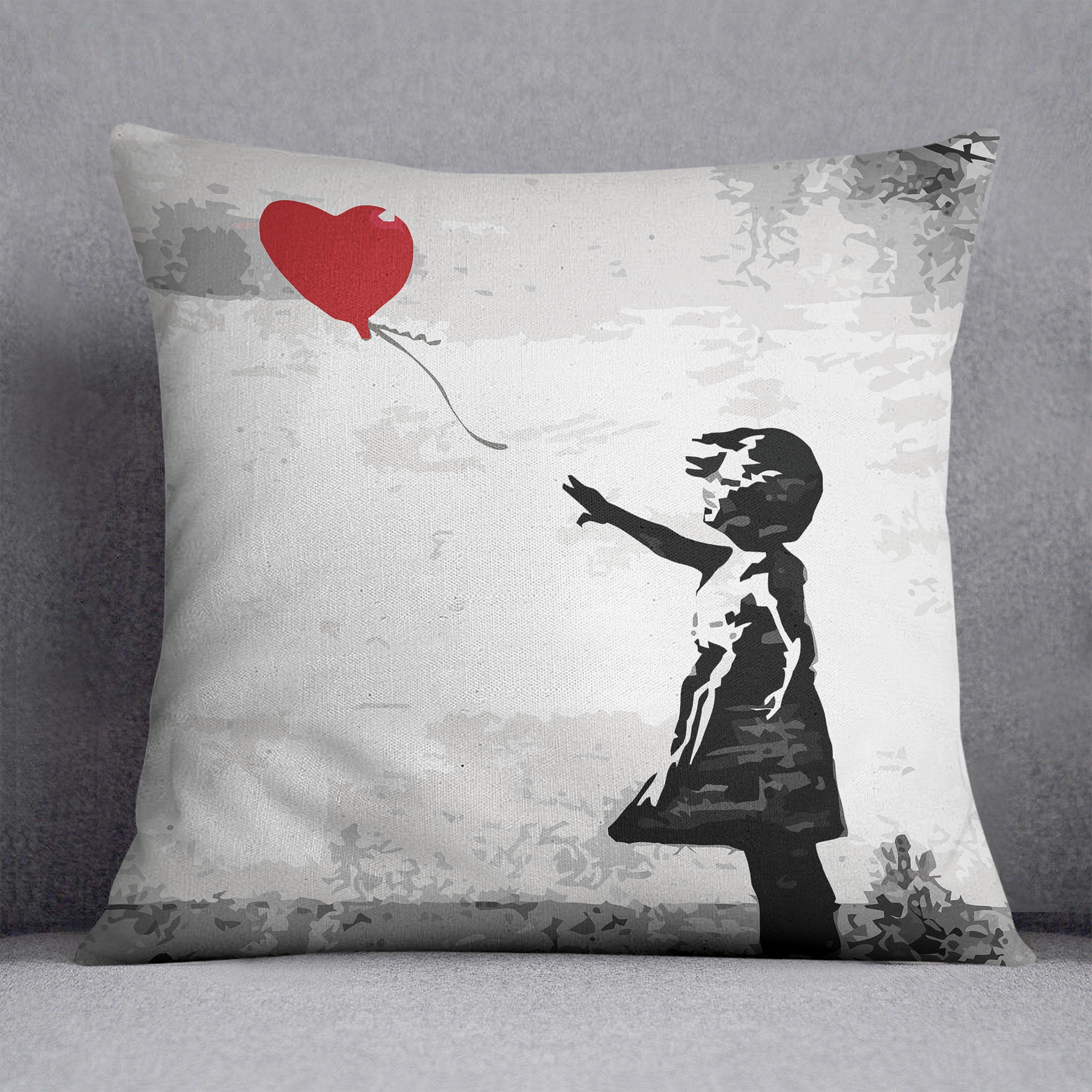 Banksy Balloon Girl Love Heart Cushion featuring vibrant colors and luxurious vegan faux suede fabric.