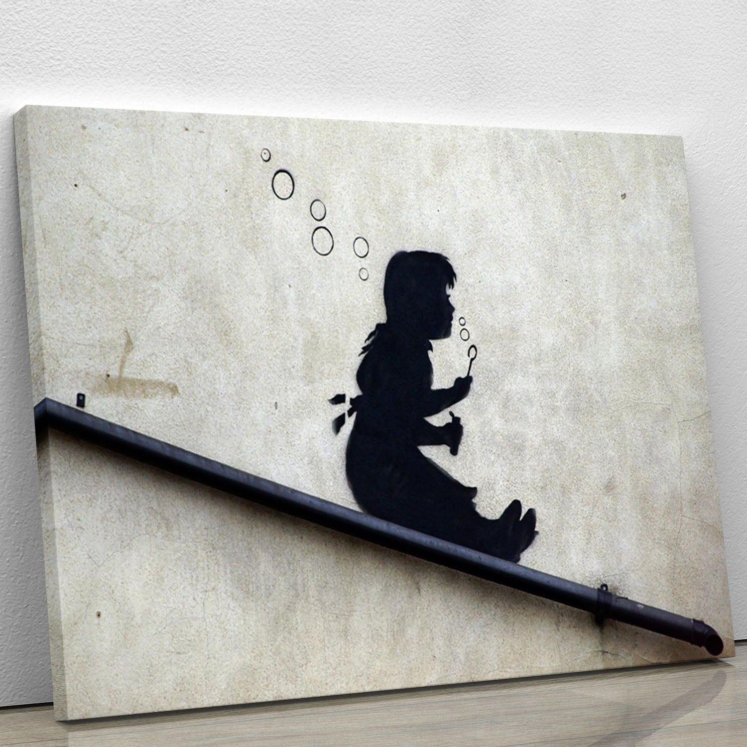 Banksy Bubble Slide Girl canvas print featuring a playful girl sliding down a bubble, showcasing vibrant colors and modern art style.